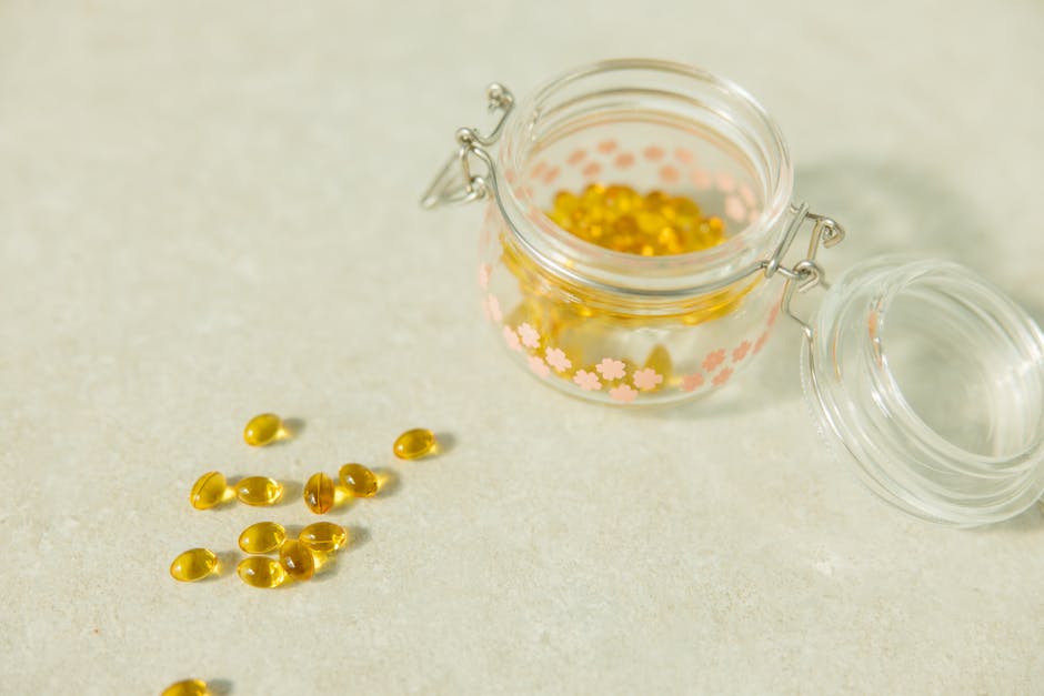 Vitamin capsules in a glass jar
